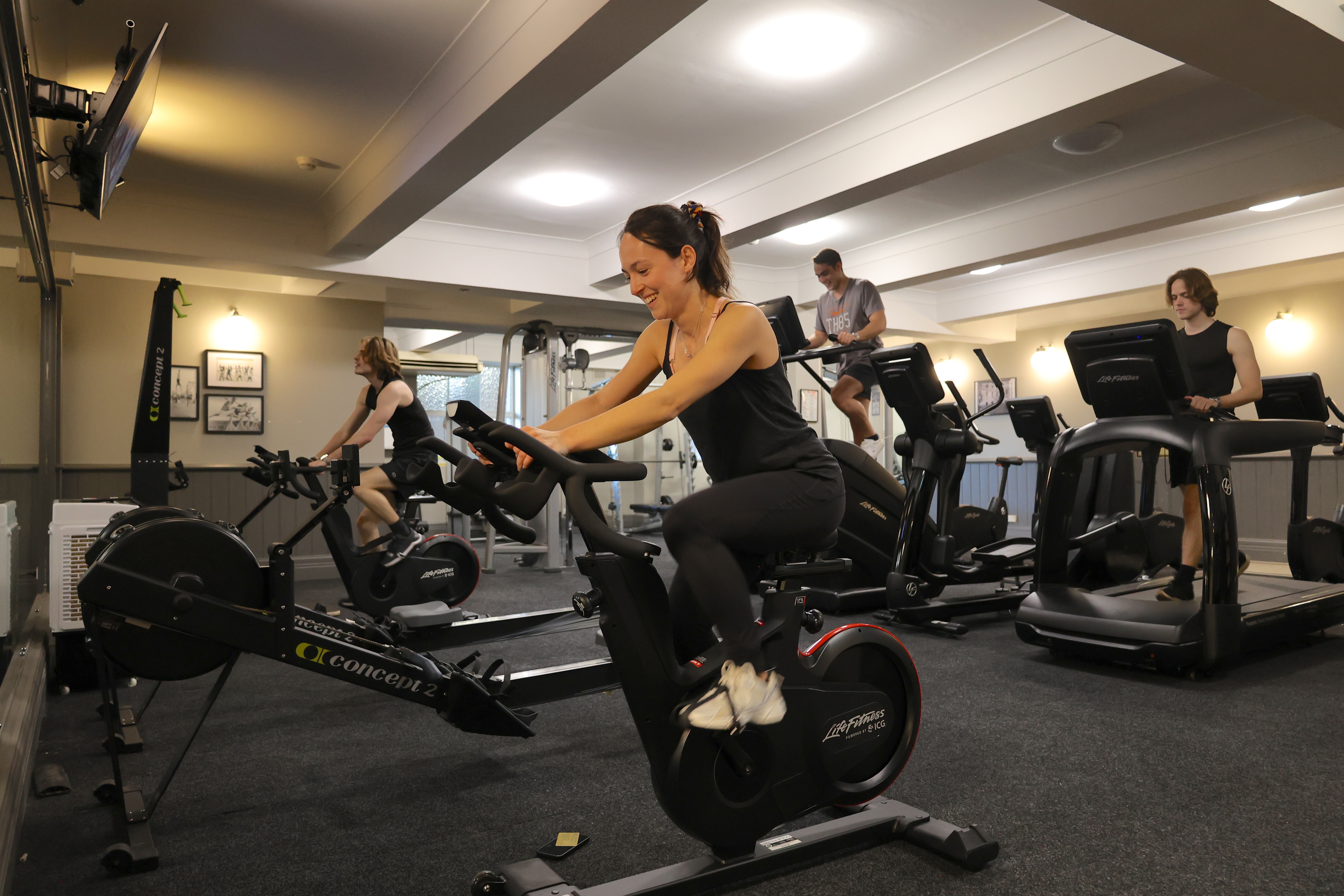 A glass of red wine being poured
